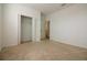Bedroom features neutral carpet, light walls and a standard closet and second entry way at 6524 Great Bear Drive Blvd, Lakeland, FL 33805