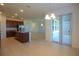Open kitchen and dining area, showcasing stainless steel appliances, granite countertops, and ample natural light at 6524 Great Bear Drive Blvd, Lakeland, FL 33805