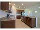 Beautiful kitchen with granite counters, stainless steel appliances, and tile flooring at 6524 Great Bear Drive Blvd, Lakeland, FL 33805