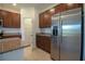 Kitchen with stainless steel refrigerator, granite counters, and ample storage space at 6524 Great Bear Drive Blvd, Lakeland, FL 33805