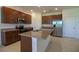 Modern kitchen featuring stainless steel appliances, granite countertops, and ample cabinet space at 6524 Great Bear Drive Blvd, Lakeland, FL 33805