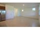 Open-concept living area with tile flooring and neutral walls creates a bright and airy atmosphere at 6524 Great Bear Drive Blvd, Lakeland, FL 33805