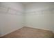 Walk-in closet featuring a carpeted floor and wire shelving around the top of the room at 6524 Great Bear Drive Blvd, Lakeland, FL 33805