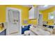 Bright bathroom featuring a shower and vanity with tiled backsplash and storage, offering a functional space at 6533 Angus Dr, Lakeland, FL 33810