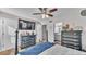 Bedroom with connecting bathroom and two dressers, ample storage and lighting at 6533 Angus Dr, Lakeland, FL 33810