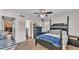 Bedroom featuring a four-poster bed with connecting bathroom and a cozy fireplace visible in background at 6533 Angus Dr, Lakeland, FL 33810