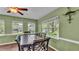 Dining area with a dark wood table and chairs, with views to the outside at 6533 Angus Dr, Lakeland, FL 33810