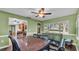 Inviting dining room with green walls, ceiling fan, and a window with a view of the outdoors at 6533 Angus Dr, Lakeland, FL 33810