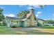 Well-maintained home features a unique stone chimney design at 6533 Angus Dr, Lakeland, FL 33810