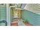 Close-up of front door with decorative stone and green siding at 6533 Angus Dr, Lakeland, FL 33810
