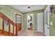 Hallway with stair access leading to the laundry room with a washer and dryer at 6533 Angus Dr, Lakeland, FL 33810