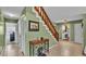 Hallway area featuring stairs, tile flooring, and neutral wall paint at 6533 Angus Dr, Lakeland, FL 33810