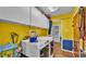 Laundry room featuring washer and dryer and yellow walls at 6533 Angus Dr, Lakeland, FL 33810