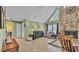 Cozy living room includes a stone fireplace and natural light at 6533 Angus Dr, Lakeland, FL 33810