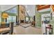 Bright living room with stone fireplace, tile flooring and vaulted ceilings at 6533 Angus Dr, Lakeland, FL 33810