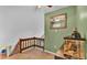 Upstairs loft area with carpet, railing, and a fish tank, offering additional living or storage space at 6533 Angus Dr, Lakeland, FL 33810