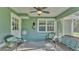 Charming screened-in porch with a ceiling fan, rattan furniture, and a view of the backyard at 6533 Angus Dr, Lakeland, FL 33810