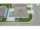 A bird's eye view of the rear of the house showing a private in-ground swimming pool and fenced yard at 7116 Cruz Ct, Lakeland, FL 33813