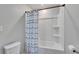 Well-maintained bathroom featuring a clean tub, modern shower curtain, and neutral color scheme at 7116 Cruz Ct, Lakeland, FL 33813