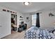 Bright bedroom with a window, cute shark bedspread, and desk with space for work or study at 7116 Cruz Ct, Lakeland, FL 33813