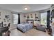 Inviting bedroom with wood-look flooring, natural light, and ample space at 7116 Cruz Ct, Lakeland, FL 33813