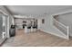 Bright kitchen featuring modern appliances, a central island with seating, and wood-look flooring at 7116 Cruz Ct, Lakeland, FL 33813