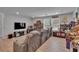 Spacious living room with comfortable seating, a large TV, and an arcade game at 7116 Cruz Ct, Lakeland, FL 33813