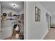 View of the walk-in pantry that features metal shelving and a standing freezer at 7116 Cruz Ct, Lakeland, FL 33813