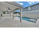 Gorgeous backyard pool and patio with ceiling fans for outdoor entertaining and relaxing at 7116 Cruz Ct, Lakeland, FL 33813