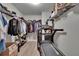 Spacious closet with extensive shelving and a hanging rod for clothes and accessories at 7116 Cruz Ct, Lakeland, FL 33813