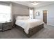 Cozy bedroom with a spacious bed, plush carpet, and ample storage drawers at 7501 Sw 107Th Ln, Ocala, FL 34476