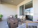Inviting outdoor patio with modern furniture, a fire pit, and a view of the backyard at 7501 Sw 107Th Ln, Ocala, FL 34476