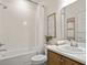 Neat bathroom features a shower-tub combo, updated fixtures, and stylish décor at 7515 Sw 107Th Ln, Ocala, FL 34476