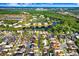Aerial view of the neighborhood with nearby lakes and mature landscaping at 8818 Tottenham Way, Kissimmee, FL 34747
