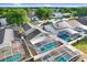 Aerial view of backyards featuring private pools with screened enclosures, showcasing a residential neighborhood at 8818 Tottenham Way, Kissimmee, FL 34747