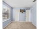 Bedroom with window, carpet flooring and a wall mounted tv at 8818 Tottenham Way, Kissimmee, FL 34747
