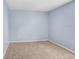 Bedroom with carpet flooring, light blue walls and base molding at 8818 Tottenham Way, Kissimmee, FL 34747