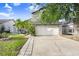 Charming two-story home with well-manicured lawn, and mature tree at 8818 Tottenham Way, Kissimmee, FL 34747