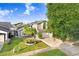Charming two-story home with a well-manicured lawn, and mature tree at 8818 Tottenham Way, Kissimmee, FL 34747