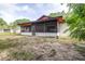 View of the screened porch and spacious backyard at 910 Van Dr, Auburndale, FL 33823