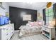 Stylized bedroom with colorful decorations and black accent wall at 910 Van Dr, Auburndale, FL 33823