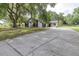 Charming home featuring stone accents, dark grey garage door, and a well-maintained front yard at 910 Van Dr, Auburndale, FL 33823
