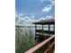 View of the gazebo at the end of the dock looking toward the lake at 910 Van Dr, Auburndale, FL 33823