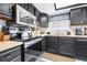 Efficient kitchen with black appliances, lighter countertops, and convenient layout at 910 Van Dr, Auburndale, FL 33823
