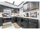 Bright kitchen featuring black cabinets, stainless appliances, and a cozy breakfast nook at 910 Van Dr, Auburndale, FL 33823