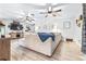 Bright living room with wood-look floors, ceiling fans, and stylish decor at 910 Van Dr, Auburndale, FL 33823