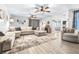 Inviting living room with ample seating, stylish decor, and wood-look flooring at 910 Van Dr, Auburndale, FL 33823