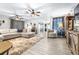 Open living room with neutral tones, wood-look floors, and comfortable seating at 910 Van Dr, Auburndale, FL 33823
