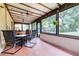 Enclosed patio perfect for enjoying the outdoors year-round at 910 Van Dr, Auburndale, FL 33823