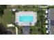 Aerial view of a community pool with lounge chairs and manicured landscaping at 943 Grandin St, Davenport, FL 33837